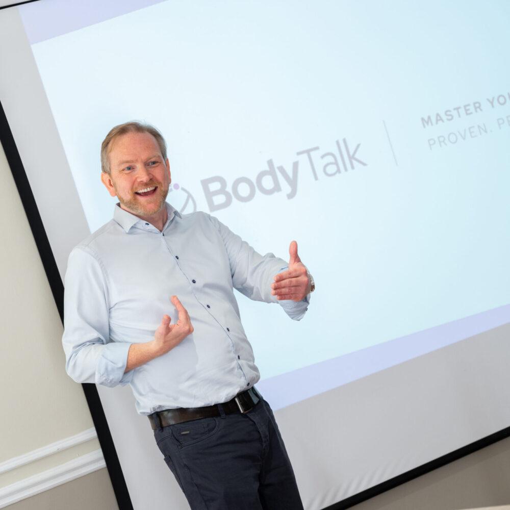 A Body Talk coach teaching workplace communication skills